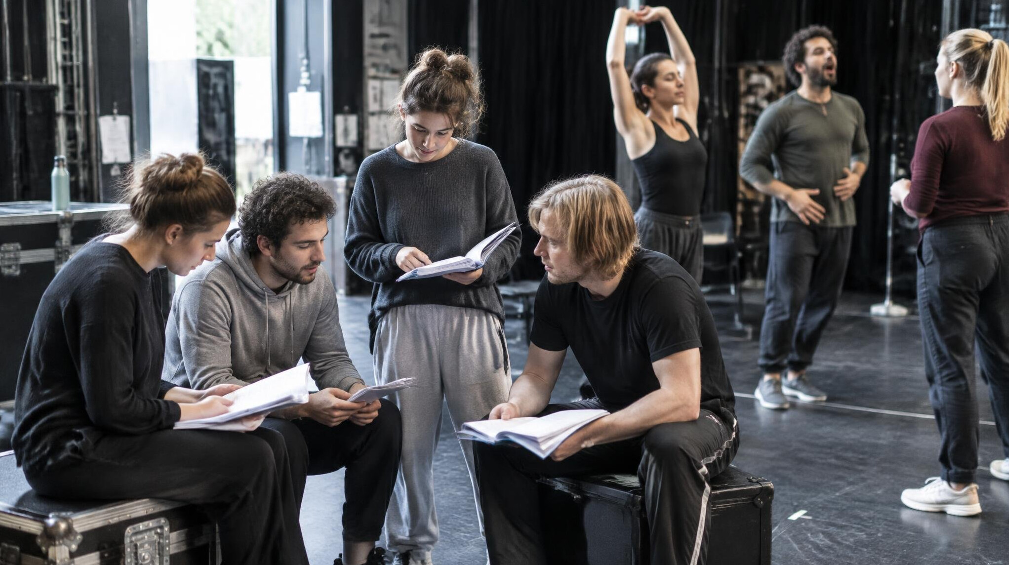 Backstage rehearsal with performers preparing before a show